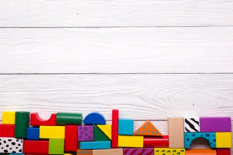 Kids educational developing toys frame on white background. Top view. Flat lay Stock Photos
