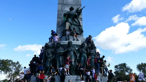 Kids escaladating historical statues Stock Footage 119863682