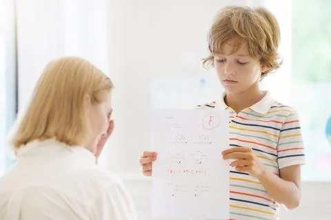 Kids fail math test in school. Child after exam. Stock Photos