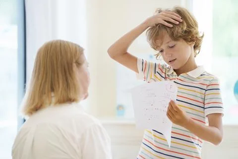 Kids fail math test in school. Child after exam. Stock Photos