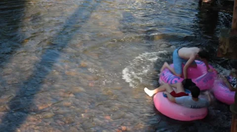 Kids floating down the river together Stock Footage 40219095