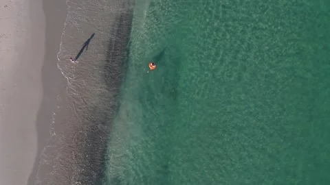 Kids Floating In Inflatable Ring In Turquoise Water, Crystal Crescent Beach Stock Footage 317785684