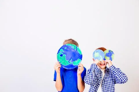 Kids with a globe Stock Photos