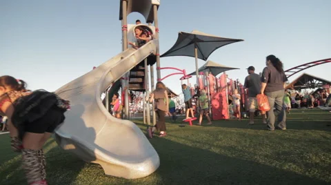 Kids going down slide at a park Video stock 49173339