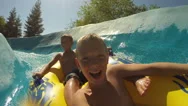 Kids Going Down A Waterslide At Waterpark, Pov Video Stock Footage