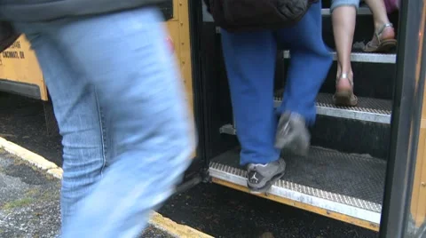 Kids going up steps of bus. (2 of 3) Stock Footage 8696480