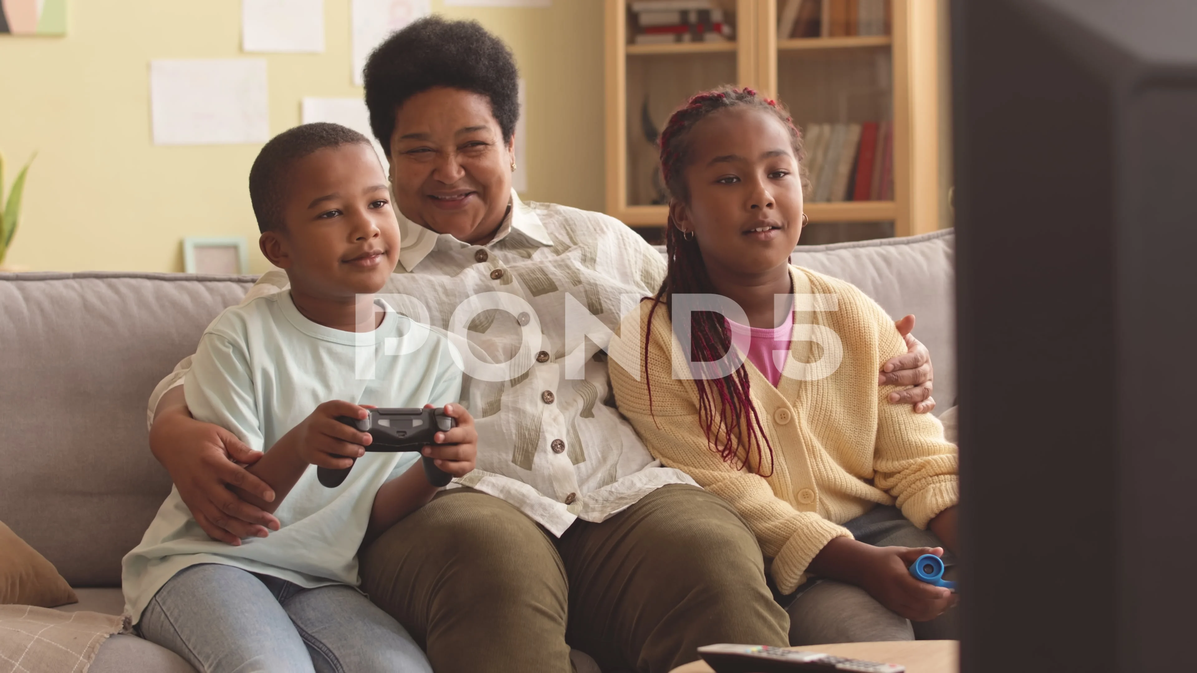 Kids with Grandma Playing Video Games at Home