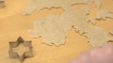Kid's hand using heart shape mold to make cookies Stock Footage 105777392