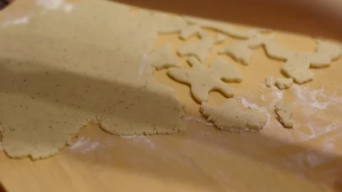Kid's hand using mold to take out cookies from dough Stock Footage 105781356
