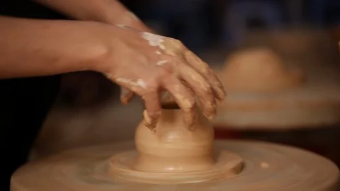 Kid's hands at pottery workshop. Creating pottery product with dirty hands on Stock Footage 107469048