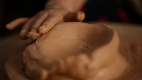 Kid's hands at pottery workshop. Creating pottery product with dirty hands on Stock Footage 107469135