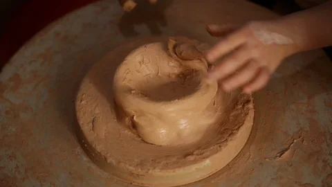 Kid's hands at pottery workshop. Creating pottery product with dirty hands on Stock Footage 107469210