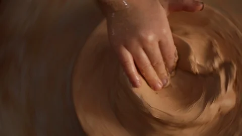 Kid's hands at pottery workshop. Creating pottery product with dirty hands on Stock Footage 107469217