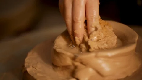 Kid's hands at pottery workshop. Creating pottery product with dirty hands on Stock Footage 107469274