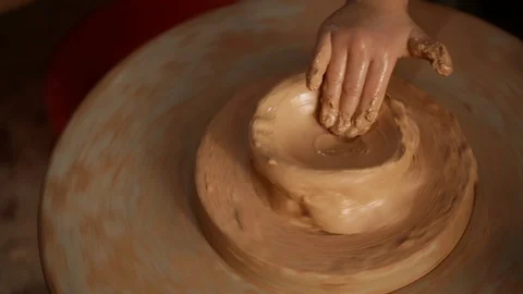 Kid's hands at pottery workshop. Creating pottery product with dirty hands on Stock Footage 107469287