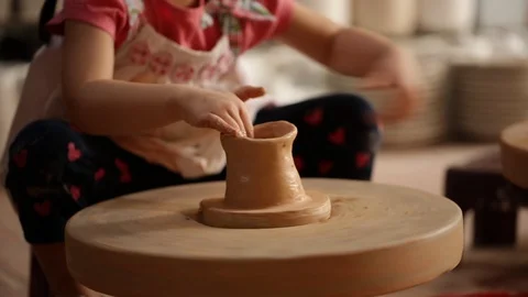 Kid's hands at pottery workshop. Creating pottery product with dirty hands on Stock Footage 107469452