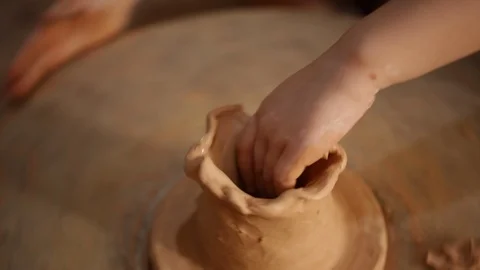 Kid's hands at pottery workshop. Creating pottery product with dirty hands on Stock Footage 107469467