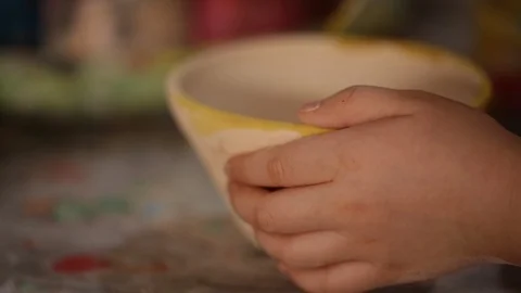 Kid's hands at pottery workshop. Designing pottery products Stock Footage 107469345