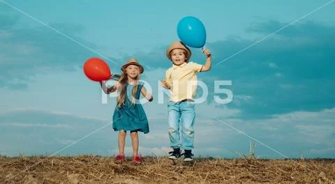 Kids having fun in autumn against blue sky. Child playing Happy childhood Stock Photos