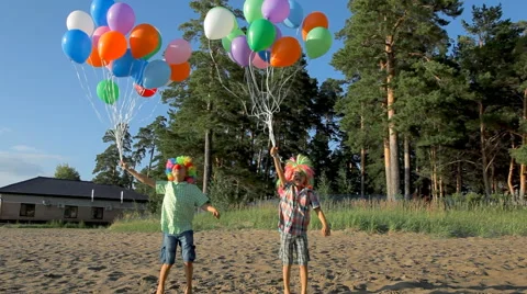Kids having fun jumping and dancing with balloons Stock Footage 53314081