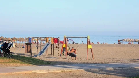Kids having fun playing on the beach Stock Footage 115632688