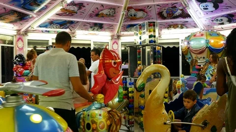 Kids having fun riding Carousel Stock-Footage 88712266