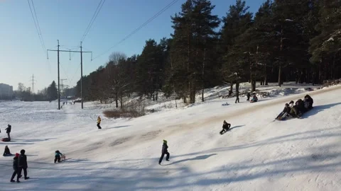 Kids having fun in snow while sledding Stock Footage 147031707