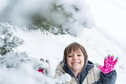 Kids having fun time in winter snow Foto stock