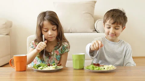 Kids having their healthy meal at home. Stock Footage