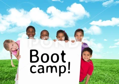 Kids holding card showing text boot camp in front of blue sky and grass Stock Photos