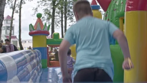 Kids Jump at Inflatable Playground Video stock 77400919