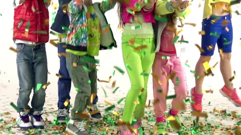 Kids Jumping And Having Fun In A Scattered Confetti Stock Footage 58877407