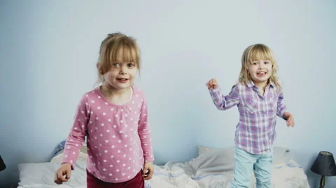 Kids Jumping on Bed Stock Footage 49764439