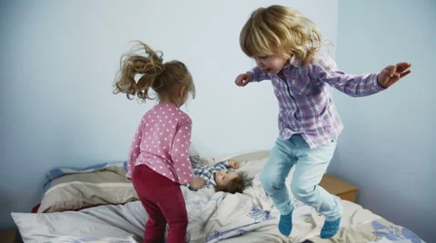 Kids Jumping on Bed Stock Footage 49766756