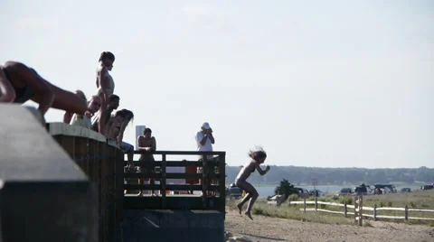 Kids jumping off bridge 2 Stock Footage 27284905