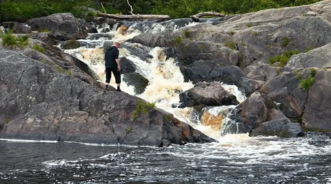 Kids Jumping Over the Waterfall Stock Footage 54956650