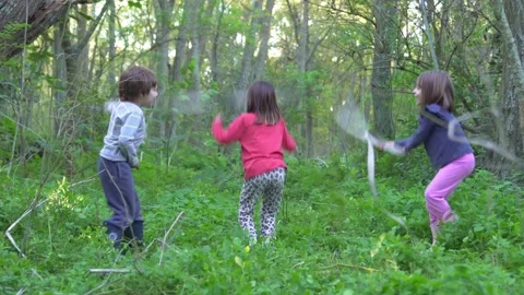 Kids jumping rope in the forest. Stock Footage 240574923