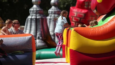 Kids jumping on trampoline Stock Footage 72343440