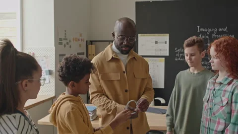 Kids Learning 3D Printer Details on Computer Class Stock Footage 245453036