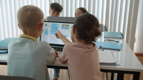 Kids Learning to Code on Laptop during Computer Group Class at School Stock Footage 280542683