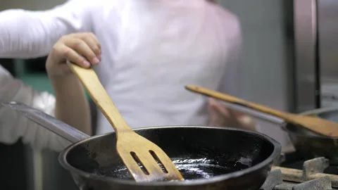Kids learning how to cook eggs in a cooking class in restaurant kitchen Stock Footage 150312171