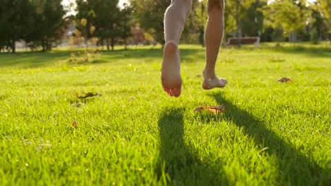 Kids legs are running close-up on the Stock Video Pond5