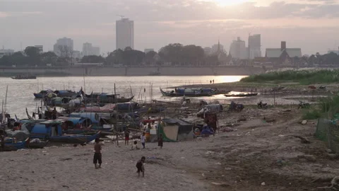 Kids living in Slum in front of developing skyscrapers in Phnom Penh Stock Footage 132518029