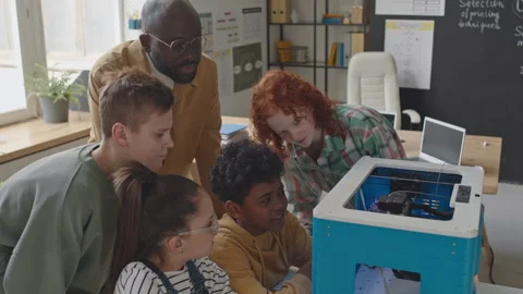 Kids Looking How 3D Printer Works on Computer Class Stock Footage 245453317