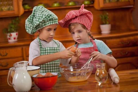 Kids make mess in the kitchen Stock Photos