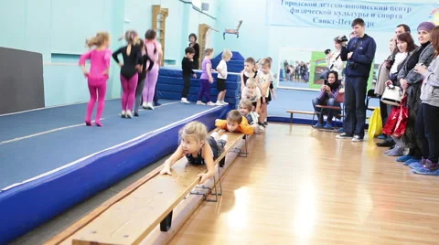 Kids making exercises when parents watching they Stock Footage 44786988