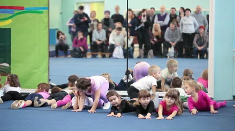 Kids making exercises when parents watching they, mirror reflection Stock Footage 44787180