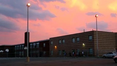 Kids olaying under the sunset Stock Footage 75654824