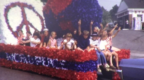 Kids PEACE Sign ANTI WAR Protest Vietnam American Parade Vintage Film Home Movie Stock Footage