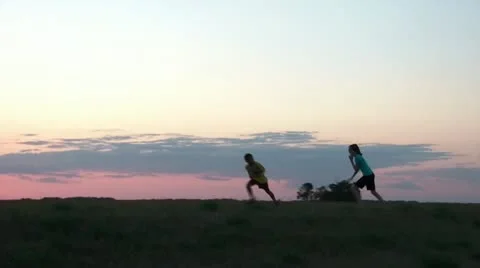 Kids Play Tag at Sunset 스톡 동영상 12592007